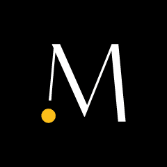 The MomCo logo with a white letter M with a small yellow dot.