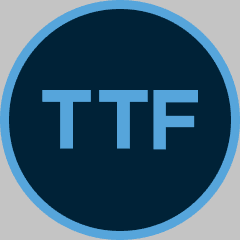 Logo with light blue letters "TTF" inside a dark blue circle bordered by a lighter blue ring.