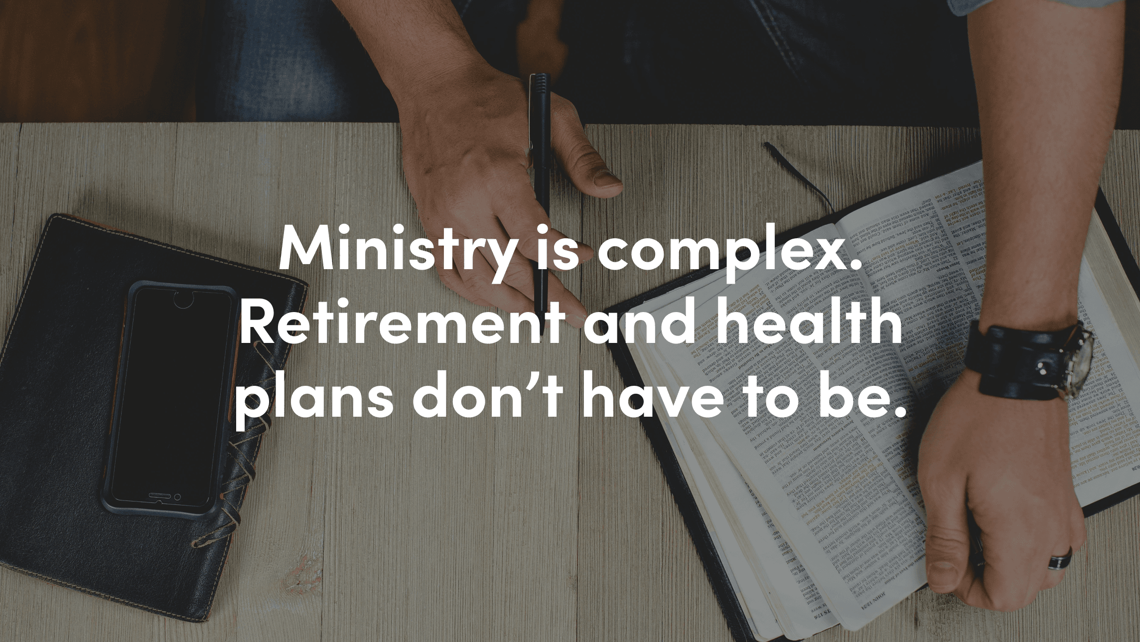 Open book and smartphone on a table with overlaid text: ‘Ministry is complex. Retirement and health plans don’t have to be.’