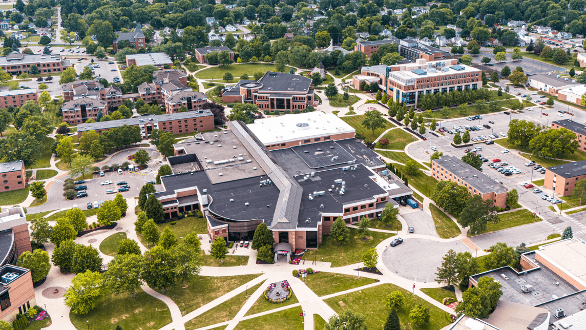 Aerial view of Indiana Wesleyan University campus with academic buildings and green spaces.