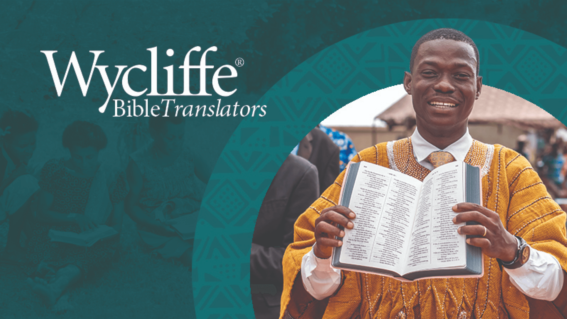 Smiling man holding a translated Bible with the text "Wycliffe Bible Translators"